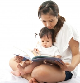 mom, baby, and book